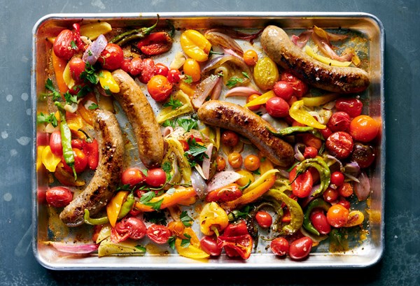 Sheet-pan sausages with peppers and tomatoes [Ali Slagle]
