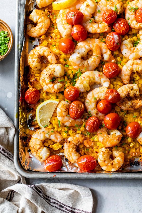 Sheet pan shrimp with corn and tomatoes