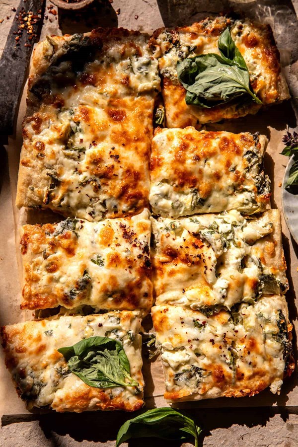 Sheet pan spinach dip pizza