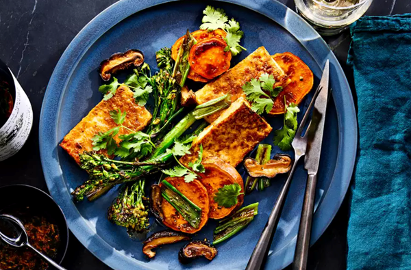 Sheet-pan tofu with broccolini, mushrooms, and sweet potatoes