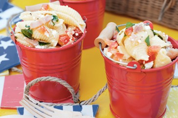 Shell pasta salad with feta, bacon, tomato and mint