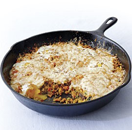 Shirred eggs with vegetable hash and smoked cheddar