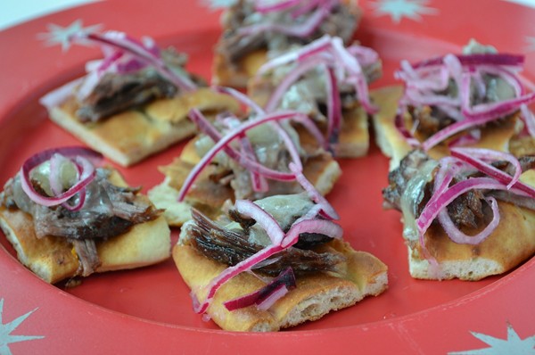 Short rib toasts with Fontina and pickled onions