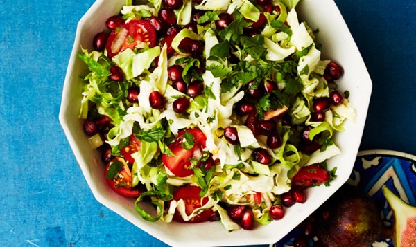 Shredded cabbage salad with pomegranate and tomatoes