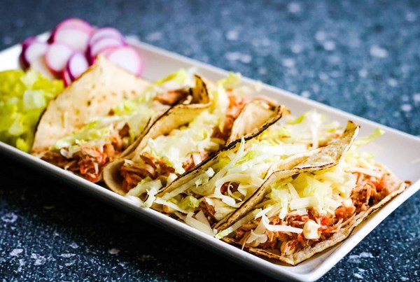 Shredded chicken tacos with corn salsa