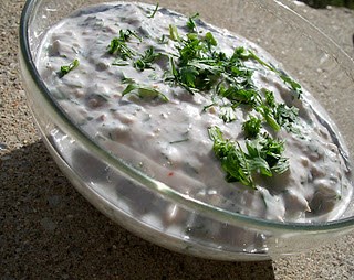 Shredded cucumbers in smooth mint-flavored yogurt (Kheera raita) 