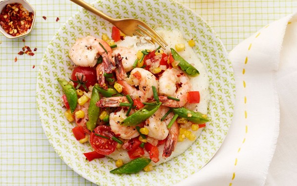 Shrimp and grits with sugar snaps and tomatoes