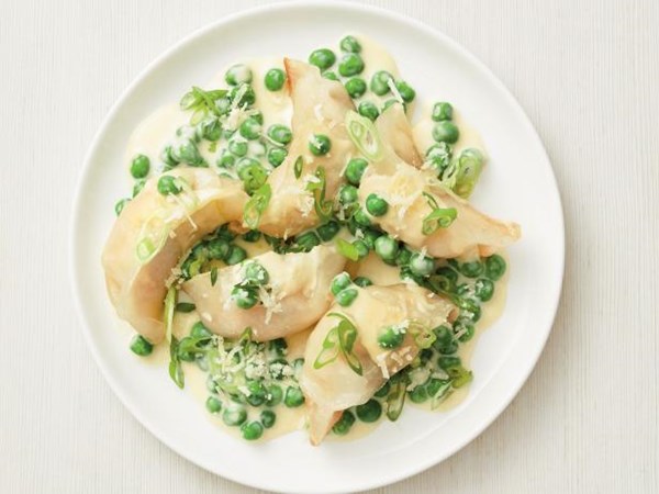 Shrimp dumpling Alfredo with peas