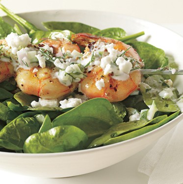 Shrimp skewers with tzatziki, spinach, and feta