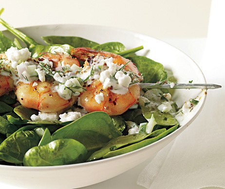 Shrimp skewers with tzatziki, spinach, and feta
