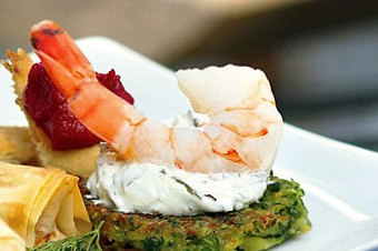 Shrimp with zucchini fritters and grape-leaf spread