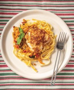 Sicilian baked chicken with green olives, golden raisins, capers, and pine nuts