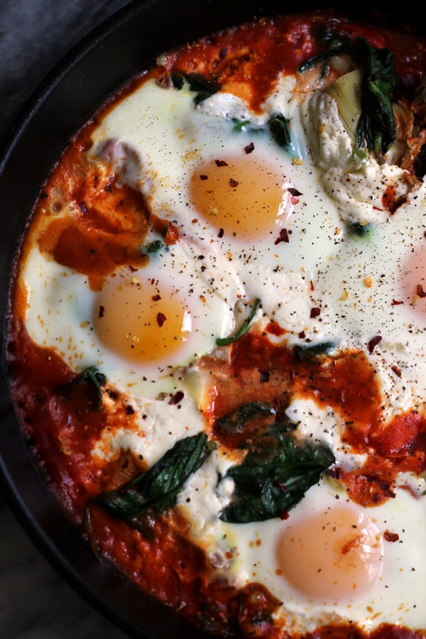 Sicilian baked eggs with artichokes, burrata, spinach, and spicy tomato sauce