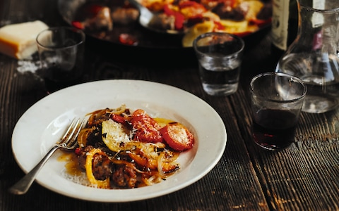Sicilian baked sausage with potato, tomato and herbs