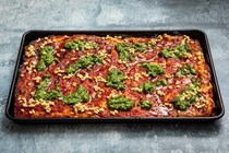 Sicilian-style pizza with buttered pine nuts and watercress pesto