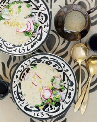 Silky eggplant soup with baby peas and radishes
