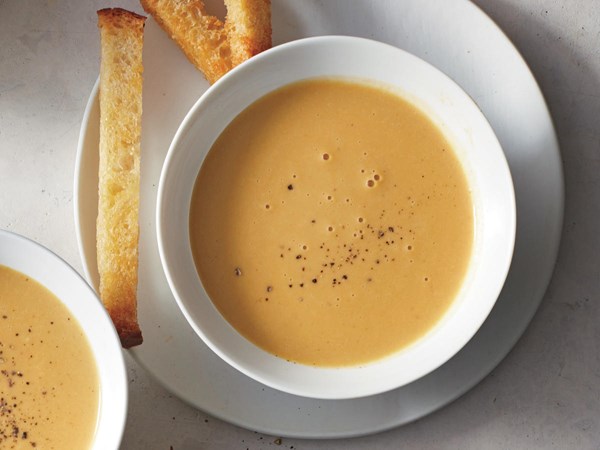 Silky garlic soup with sourdough soldiers