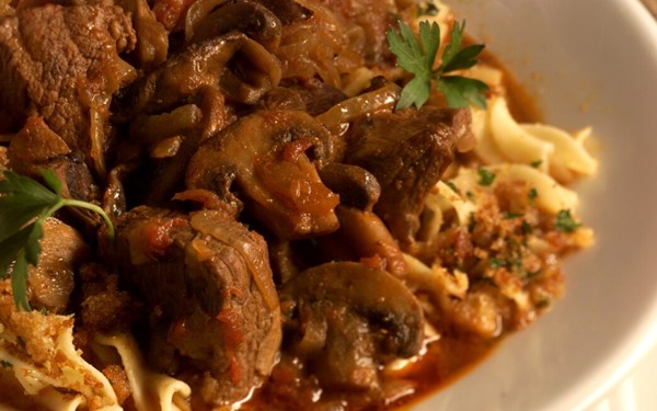 Simmered beef goulash with mushrooms 