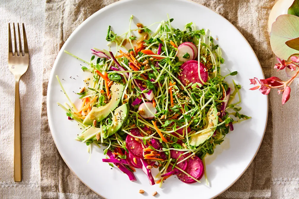 Simple spring salad with crunchy seeded cressing