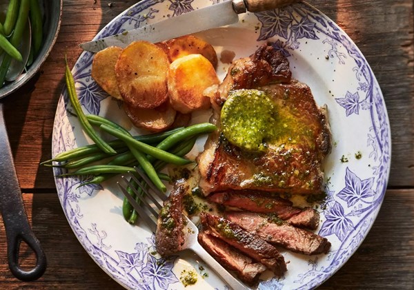 Sirloin steak with oregano & parsley butter and potatoes
