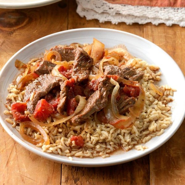 Sirloin strips over rice