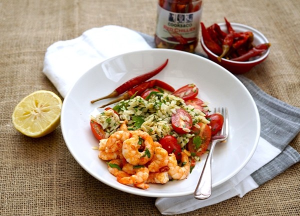 Sizzling prawns in chilli butter with orzo, herb and tomato salad