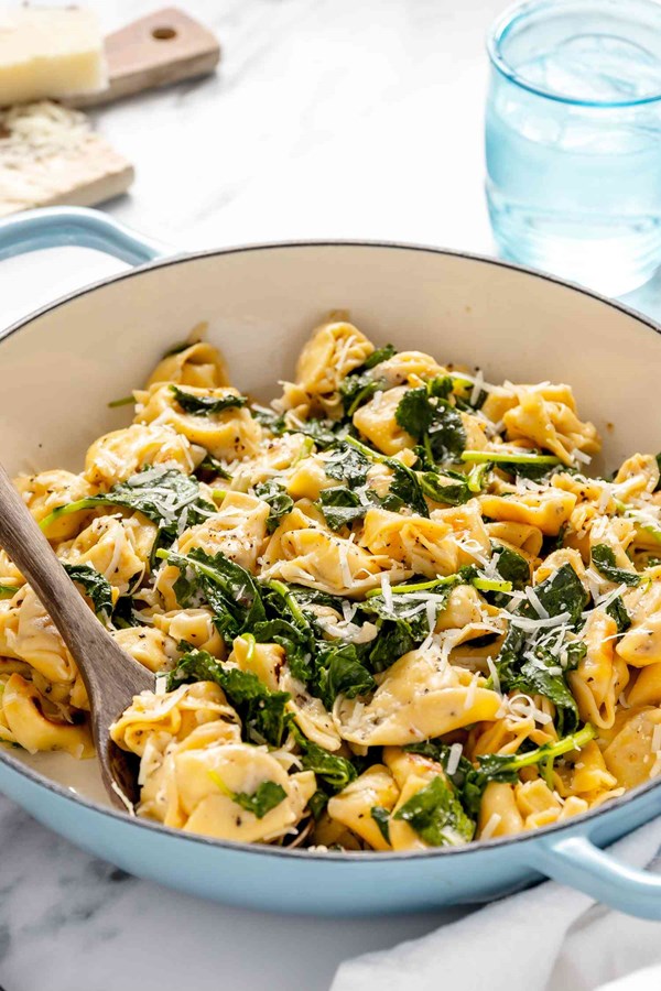 Skillet cacio e pepe tortellini with wilted greens 