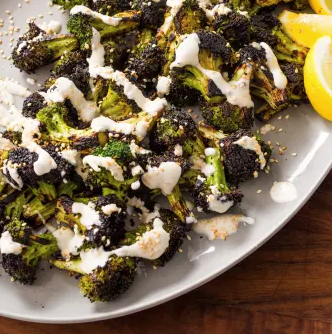 Skillet-charred broccoli with sesame seeds and yogurt sauce