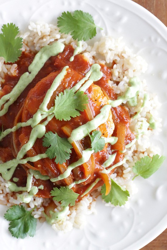 Skillet chicken in tomato-chipotle sauce with avocado crema