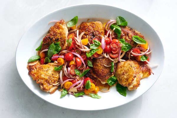 Skillet chicken thighs with schmaltzy tomatoes 