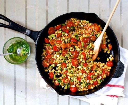 Skillet corn, edamame, and tomatoes with basil oil