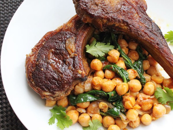 Skillet lamb chops with harissa, spinach and chickpeas