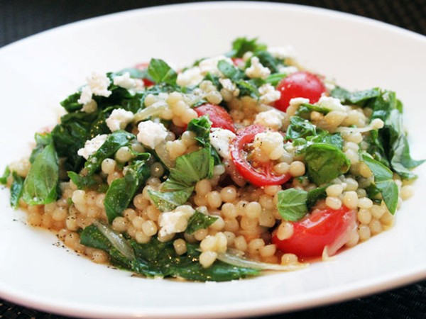 Skillet pearled couscous with tomatoes, feta, and spinach