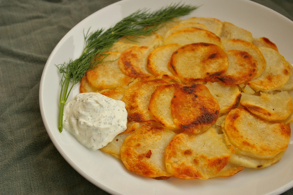 Skillet potato cake with dill sour cream