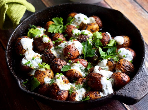Skillet potatoes with Cajun blackening spices and buttermilk-herb sauce
