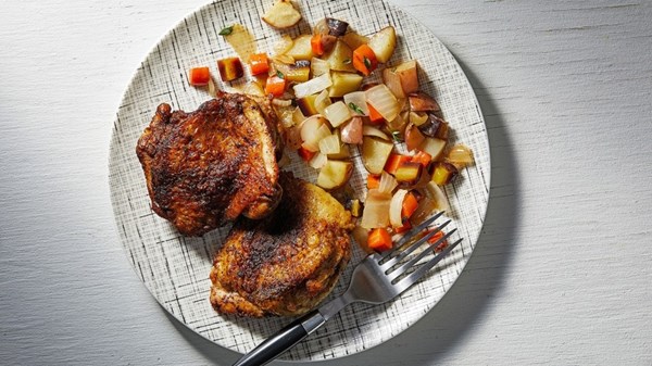 Skillet-roasted chicken thighs with potato-carrot hash