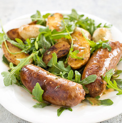 Skillet sausage and potatoes with arugula