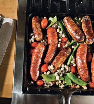 Skillet sausages with black-eyed peas, Romano beans, and tomatoes