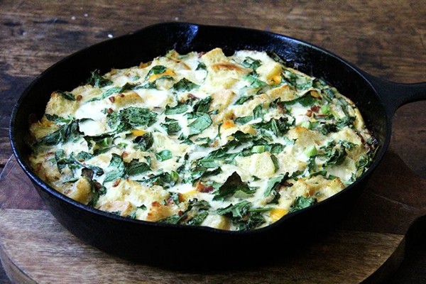Skillet strata with bacon, cheddar, and greens