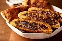 Skillet-toasted beef-stuffed pitas (Arayes)