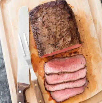 Skillet top loin roast with garlic-herb butter