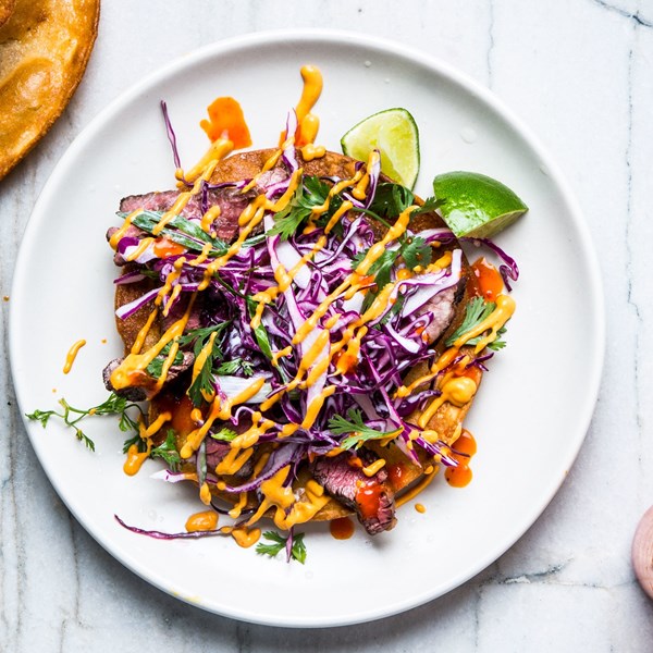 Skirt steak tostadas with cashew salsa and red cabbage slaw