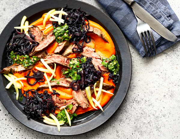 Skirt steaks with carrot puree and braised cabbage