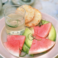 Sliced melon, toasted coconut macaroons and kaffir lime syrup
