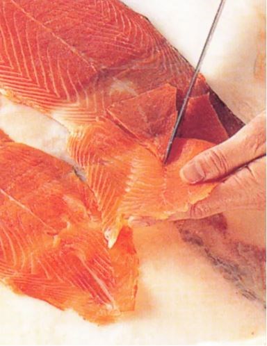 Slicing smoked salmon