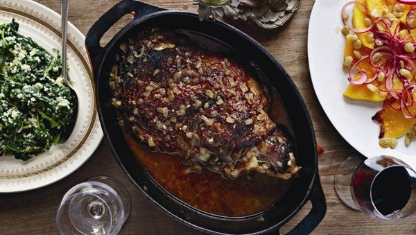 Slow-braised leg of lamb with tomato and pomegranate glaze