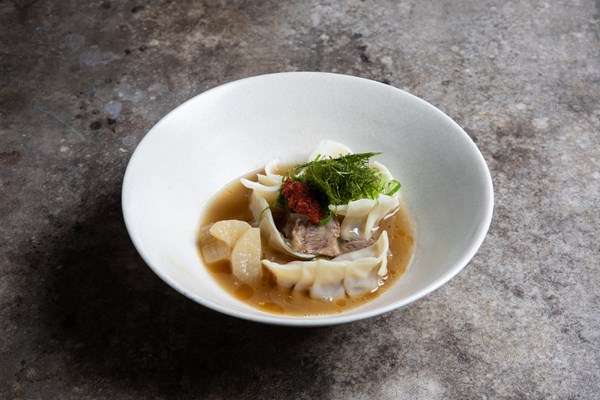 Slow-cooked beef dumpling broth with Korean chilli sauce (Dadegi)