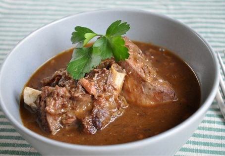 Slow-cooked chicken in wine and mushroom sauce (Coq au vin)