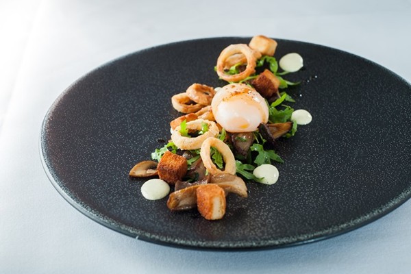 Slow-cooked duck egg with wild mushrooms, crispy shallots and tarragon dressing
