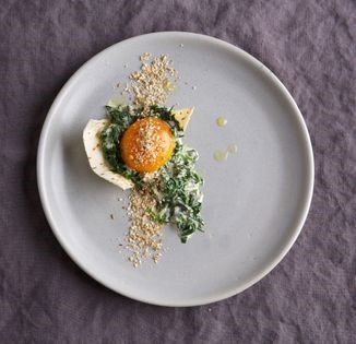 Slow-cooked duck egg yolk with creamed spinach and dukkah